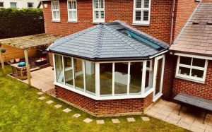 Solid tiled conservatory roof system installed on brick house in Cheshire