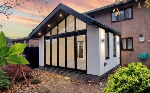 Modern warm roof extension with black frame windows in Cheshire